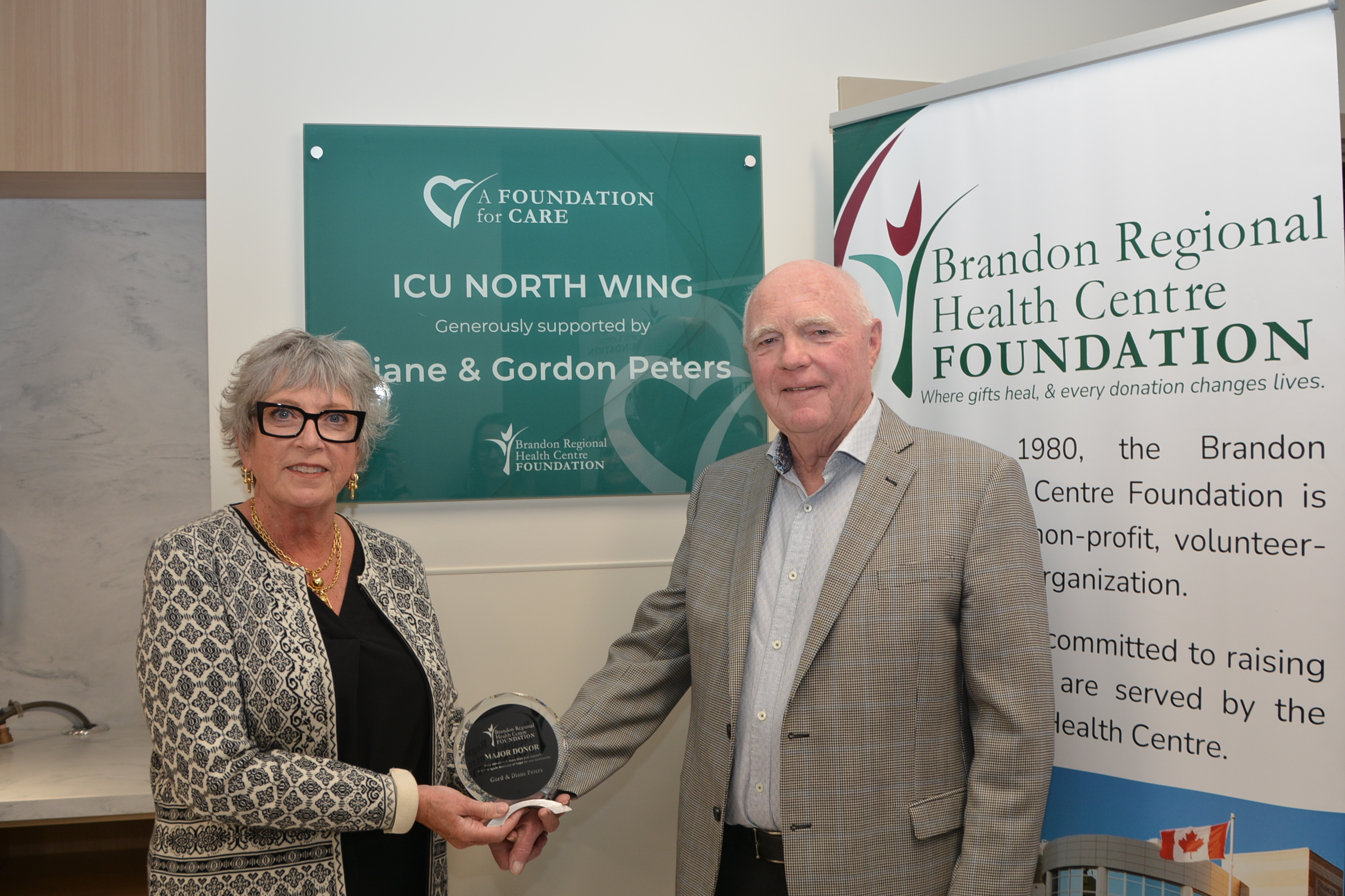 peters with their plaque Female doctor speaking with young female patient. Patient wears a pink bandana.